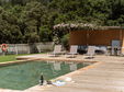 Swimming pool area in holiday home Casa Dàlia